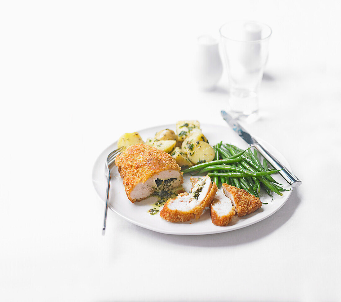 Chicken Kiev (stuffed and breaded chicken fillet) with green beans