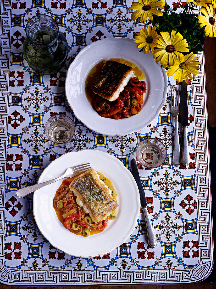 Hake with braised peppers and olives