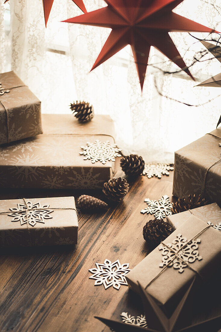 Christmas presents wrapped in wrapping paper with a snowflake design