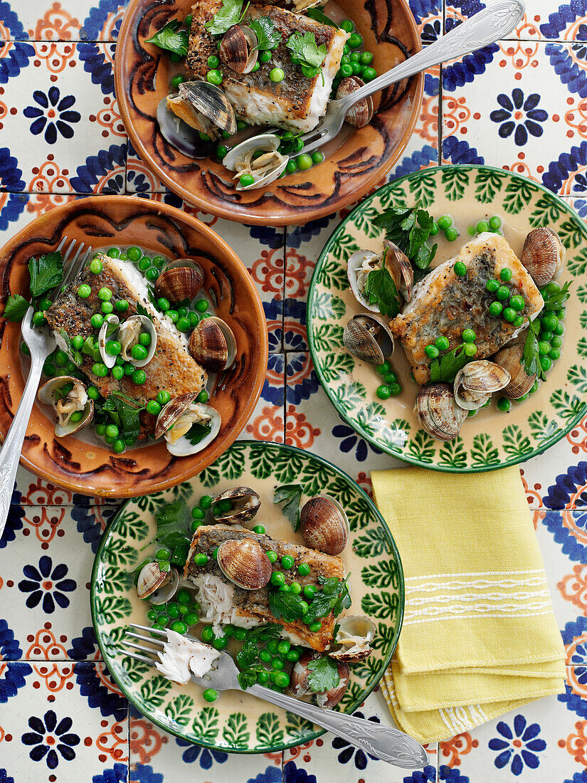 Hake with clams, white rioja, and peas