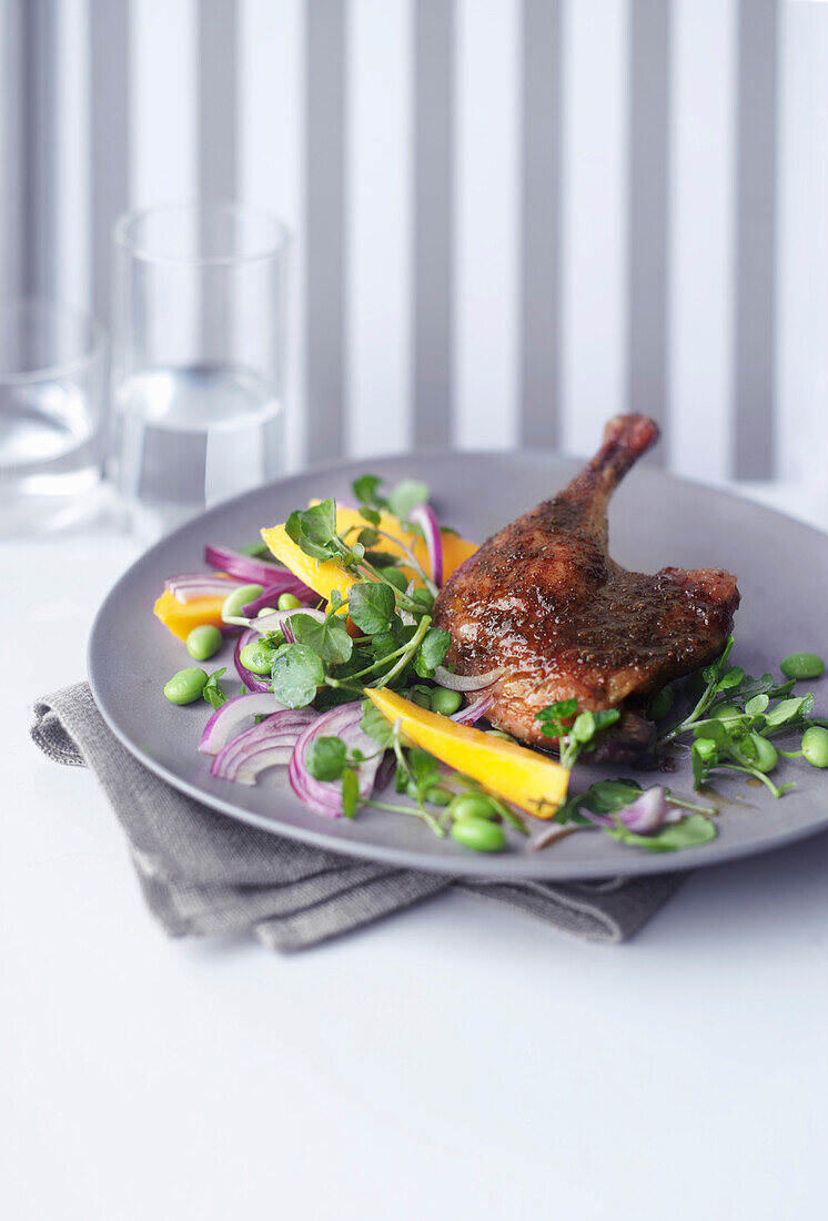 Roasted duck leg with mango and watercress salad