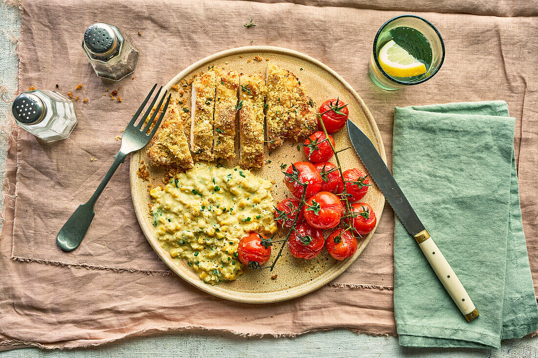 Baked chicken schnitzel with creamed corn