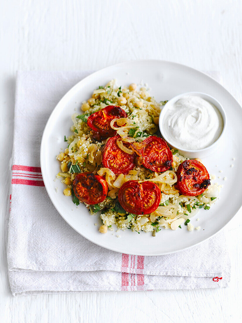 Harissa roasted tomatoes on couscous