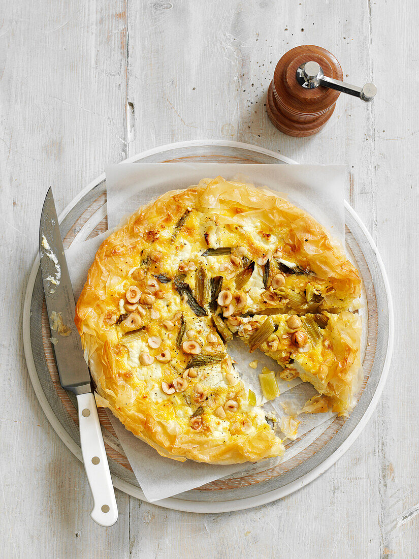 Goat's cheese and hazelnut tart with spring onions