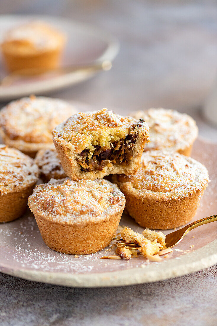 Mincemeat pies with date-apple filling in cinnamon shortcrust pastry and almond frangipane topping