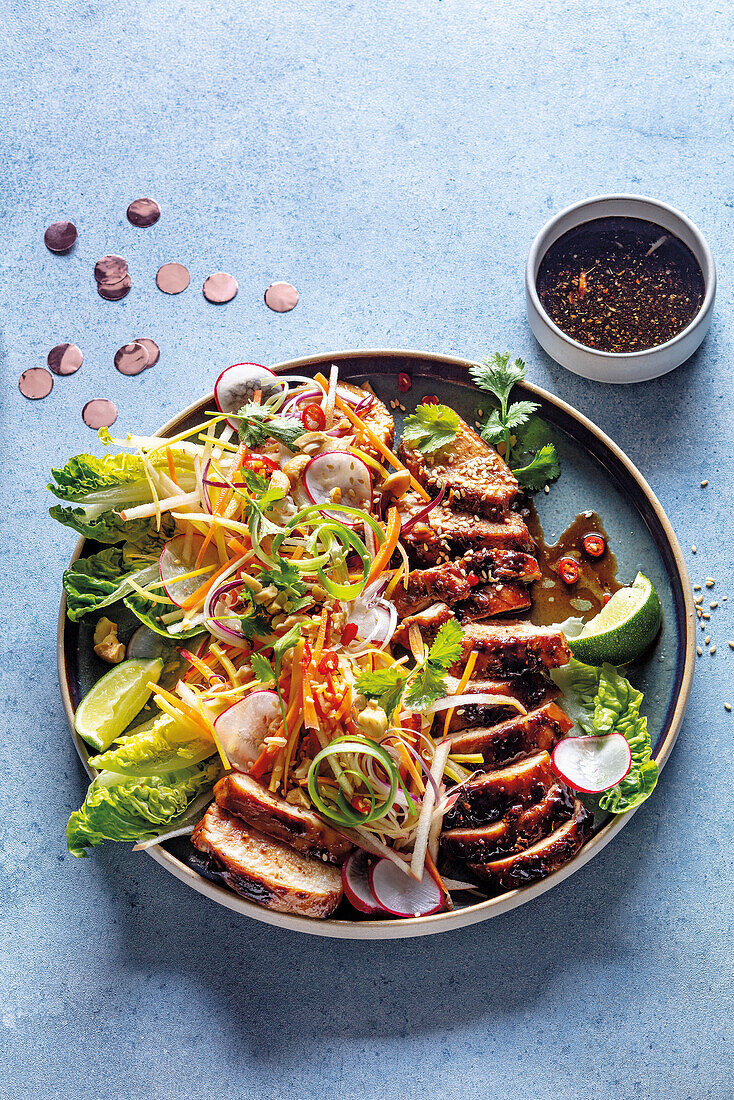 Slow-roasted pork belly with Asian BBQ sauce and salad