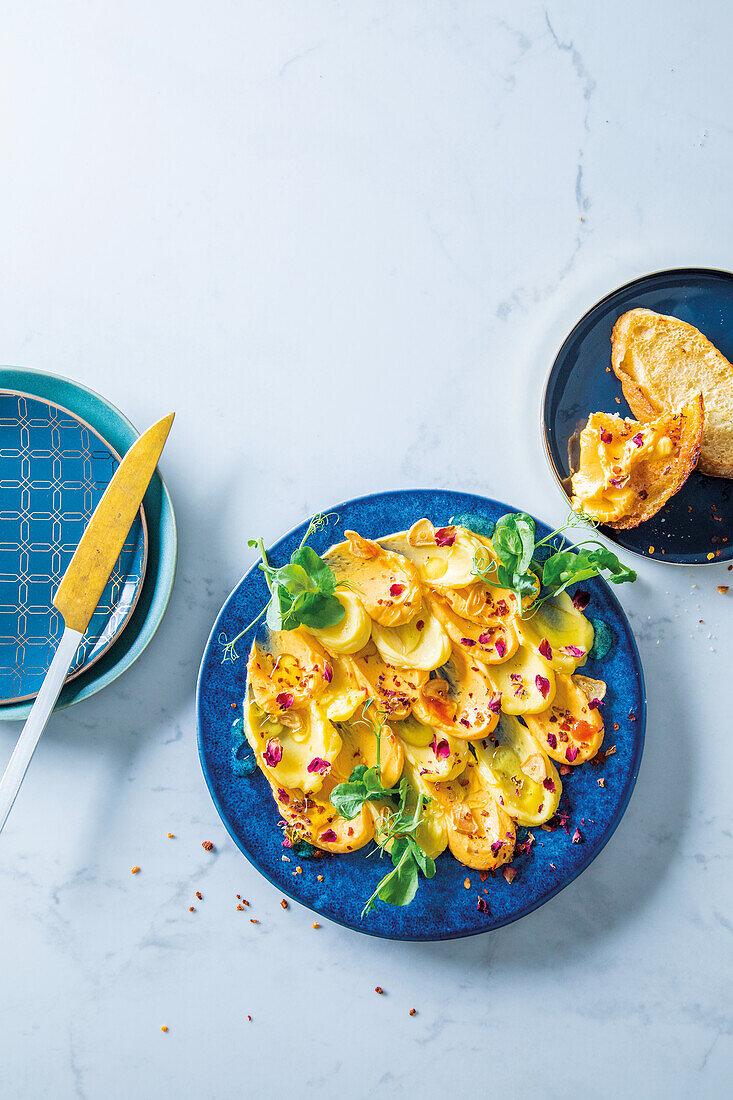 Harissa and honey butter board with rosebuds and chilli flakes