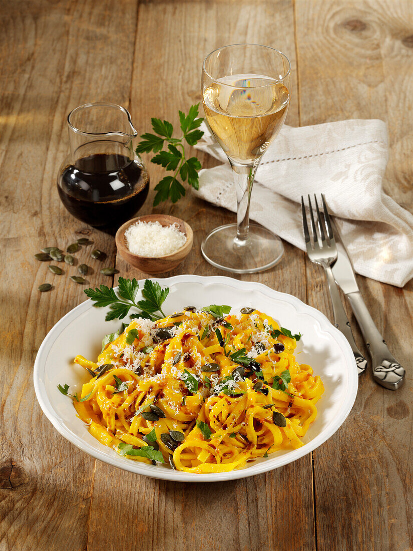 Pasta with pumpkin sauce and pumpkin seeds