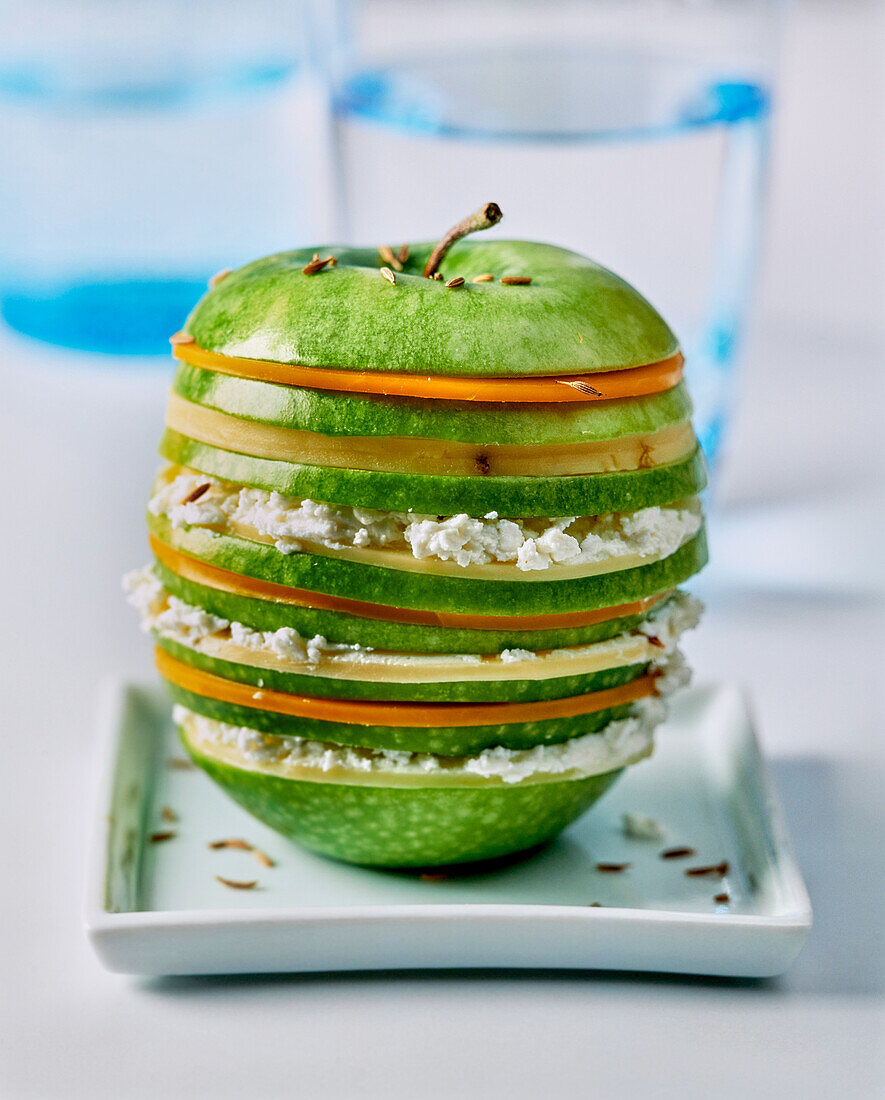 Layered green apple stuffed with three kinds of cheese