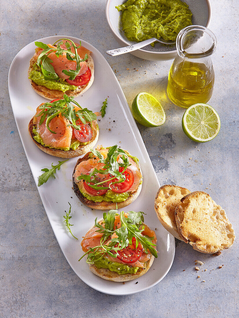 English muffins with guacamole and smoked salmon