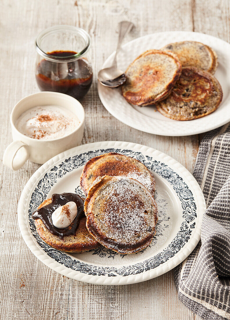 Poppy seed pancake with plum butter and cinnamon cream