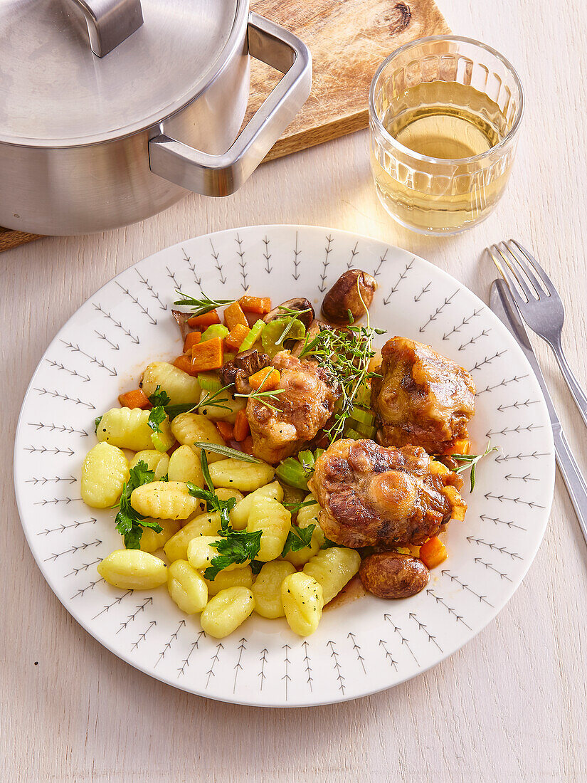 Braised veal tail with vegetables and gnocchi