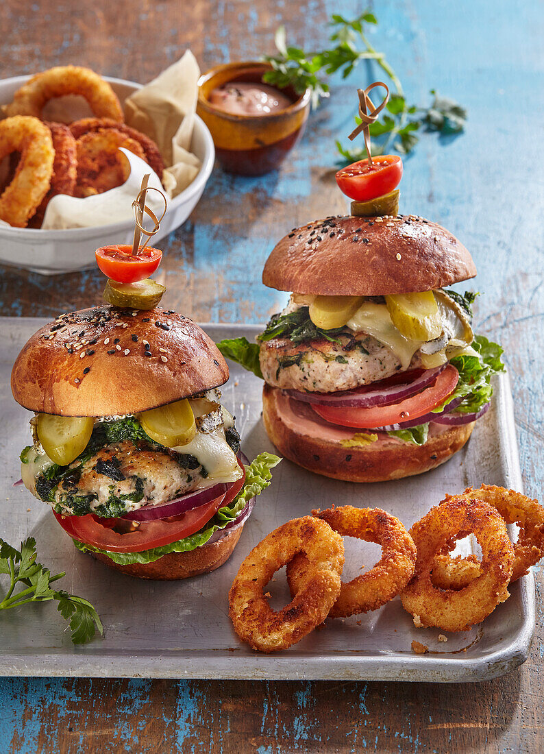 Chicken cheeseburger with fried onion rings