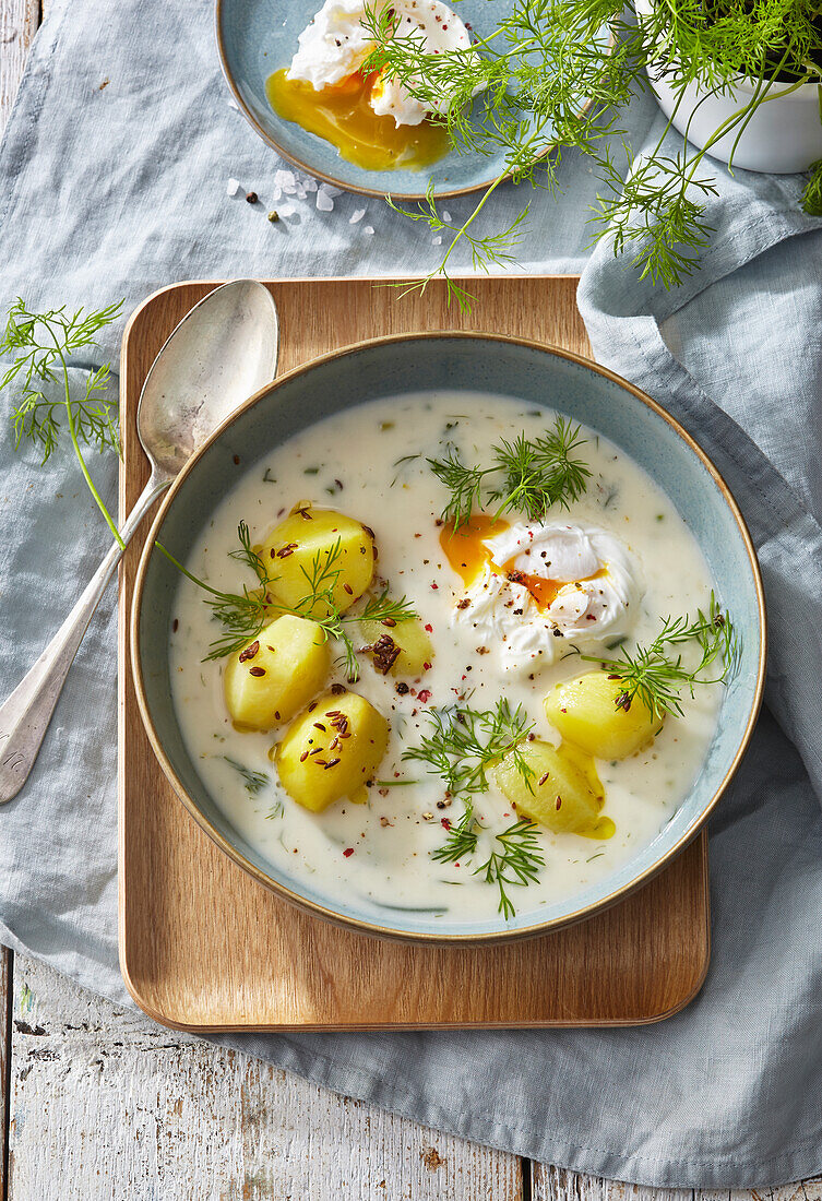 Creamy dill sauce with potatoes and poached egg