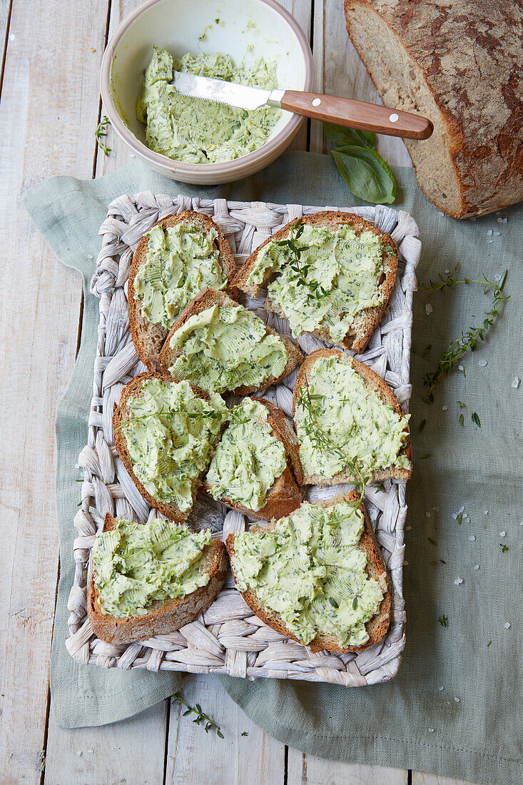Slices of bread topped with herb butter