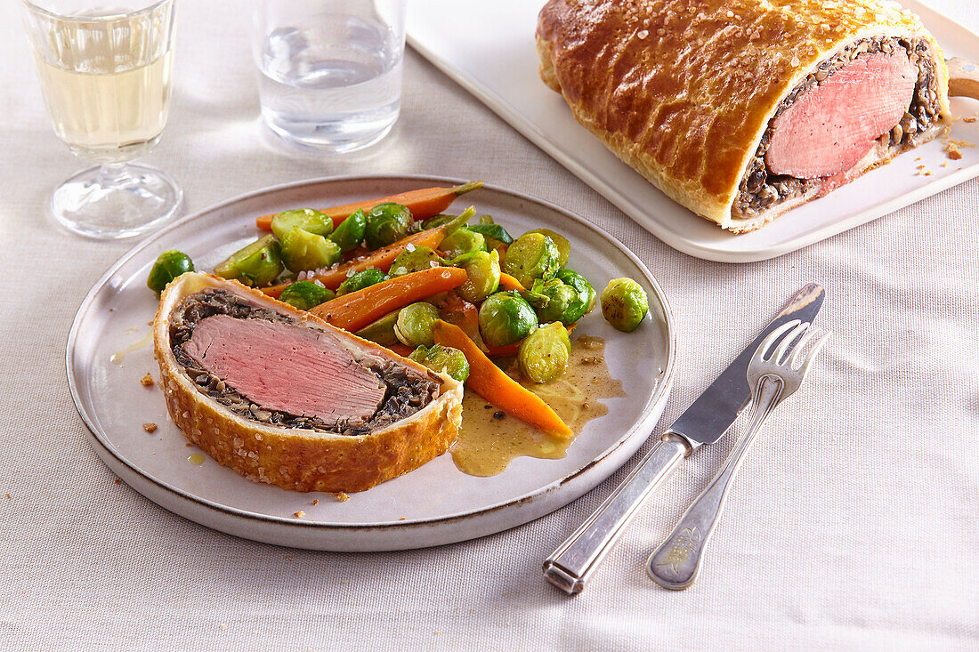 Beef Wellington with Brussels sprouts and carrot vegetables