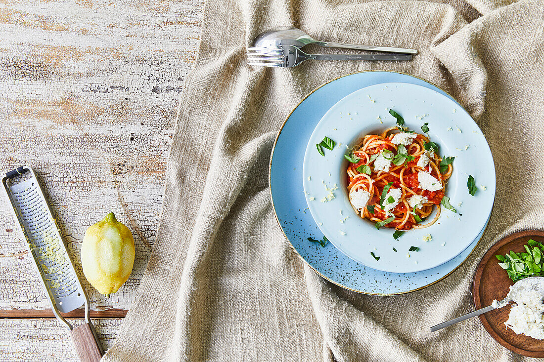 Spaghetti Topped with Tomato Sauce, Dollops of Ricotta and Fresh Chopped Basil