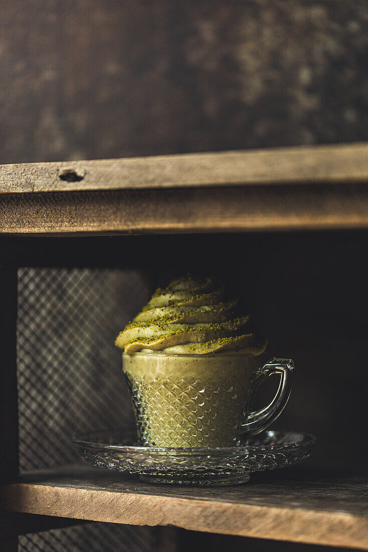 Vegan pistachio pudding in a glass cup