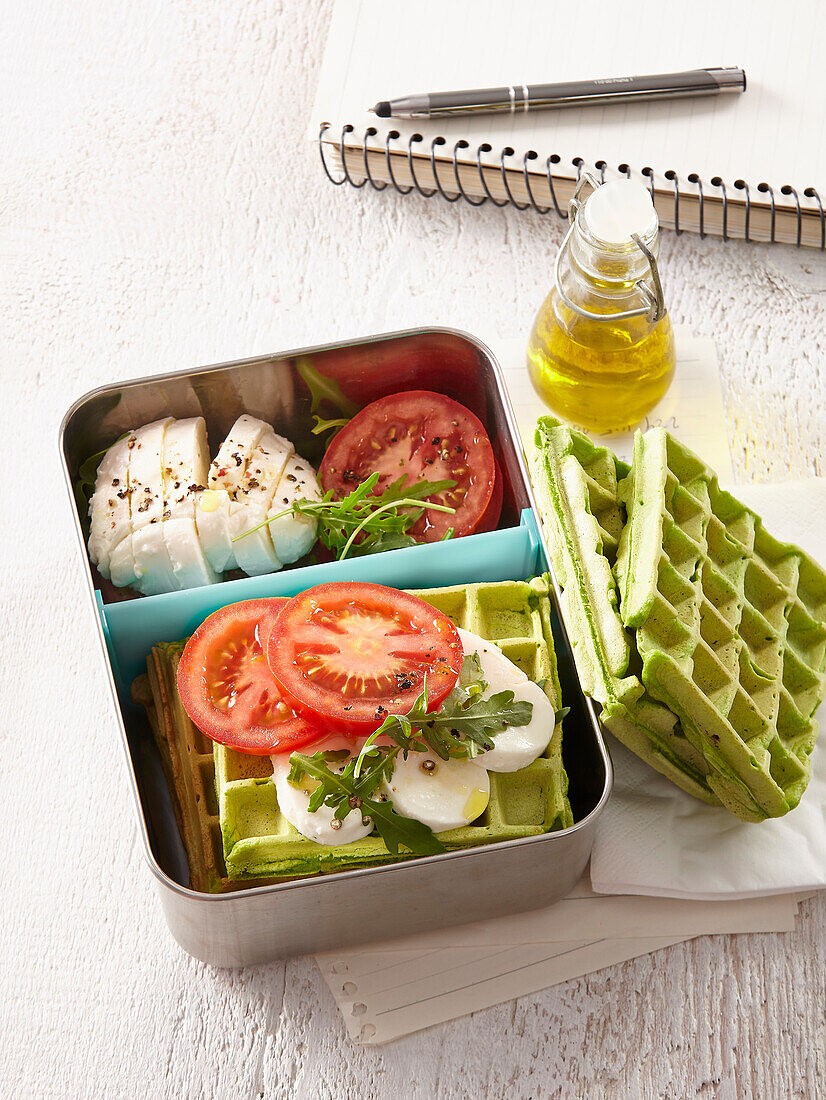 Spicy spinach waffles with egg and tomato to go in lunch box