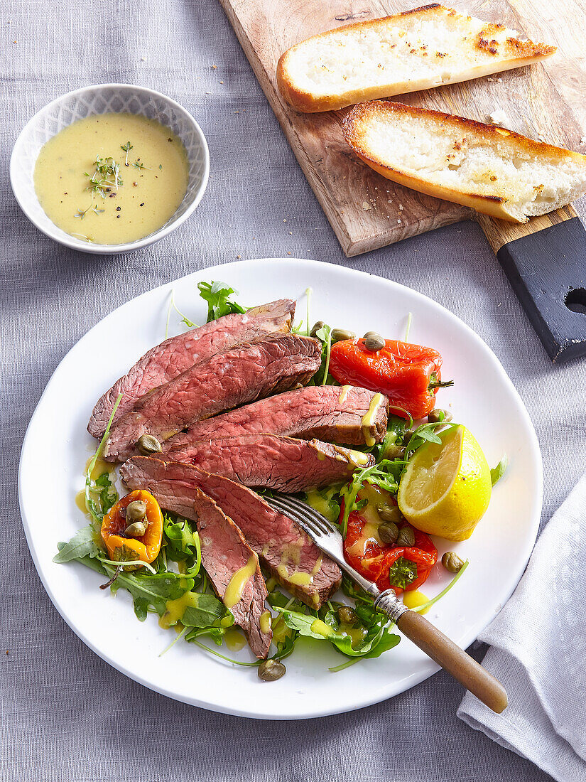 Grilled flank steak with salad