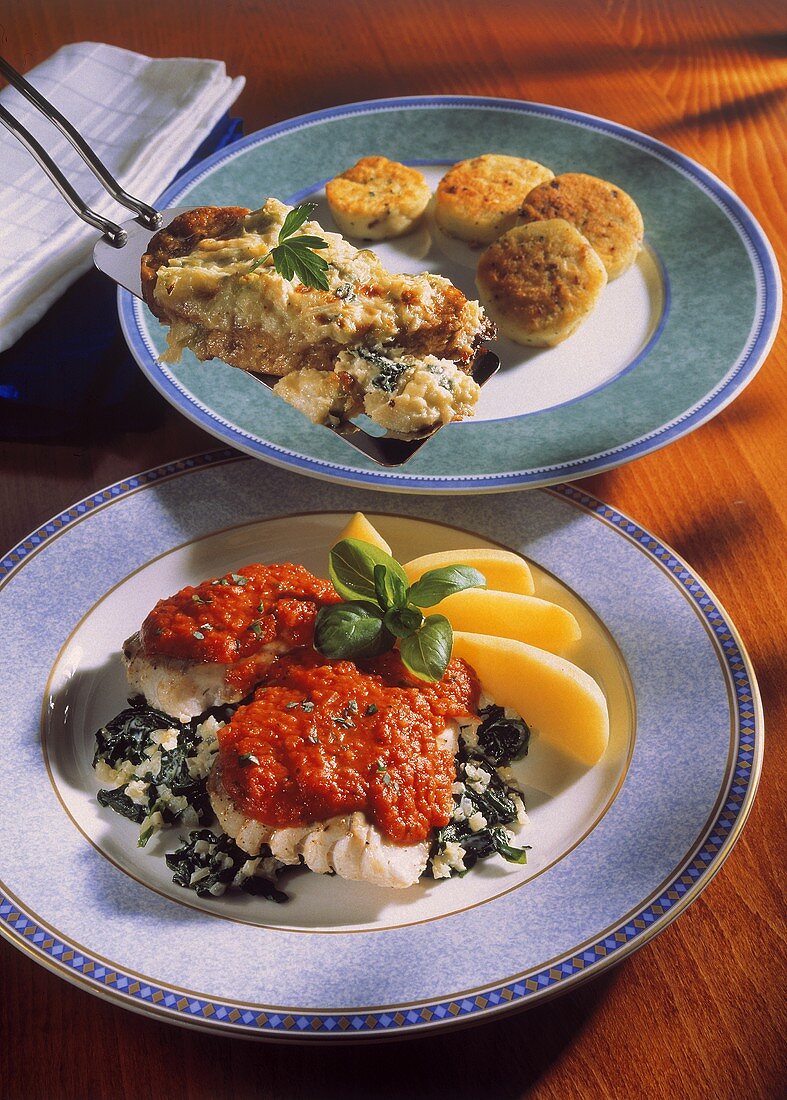 Coley on bed of spinach and baked chicken medallions