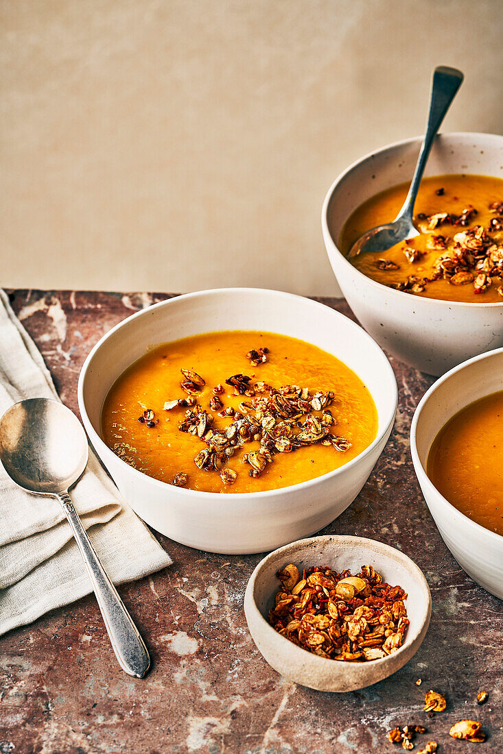 Pumpkin soup with hearty muesli as a topping