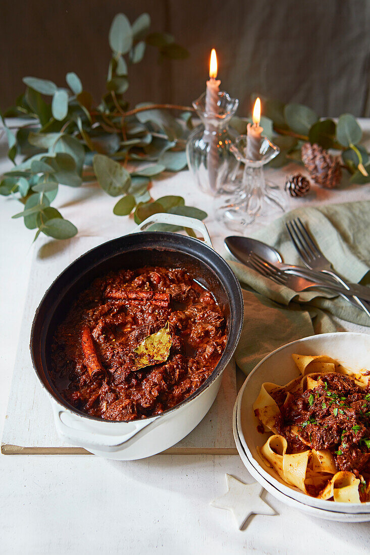 Beef stew with papardelle on a festive table setting