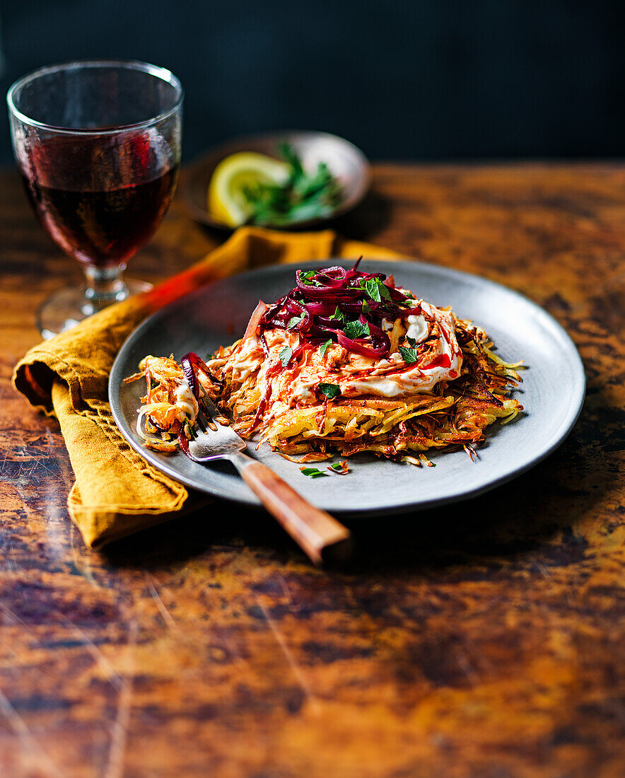 Parsnip rösti with harissa, feta, and caramelized red onions