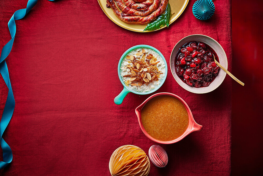 Bread sauce with flaked almonds and caramelized shallots, gravy, and juicy cranberry sauce