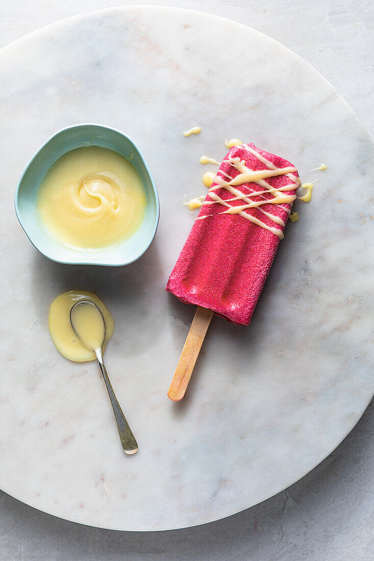 Blood-red peach and thyme ice cream on a stick