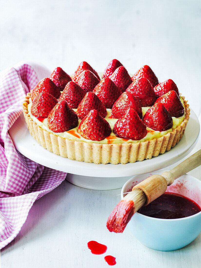 Classic French strawberry tart with raspberry icing