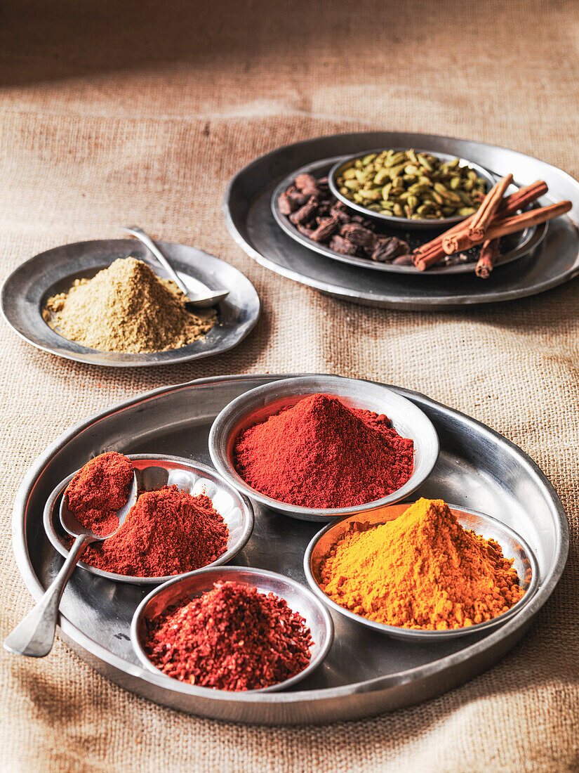 Indian spices - turmeric, chili powder, chilli flakes, garam masala, coriander, cinnamon, cardamom