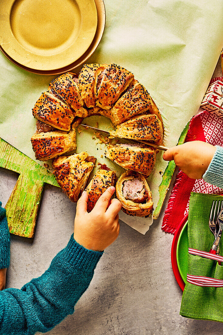 Puff pastry wreath with sausage filling