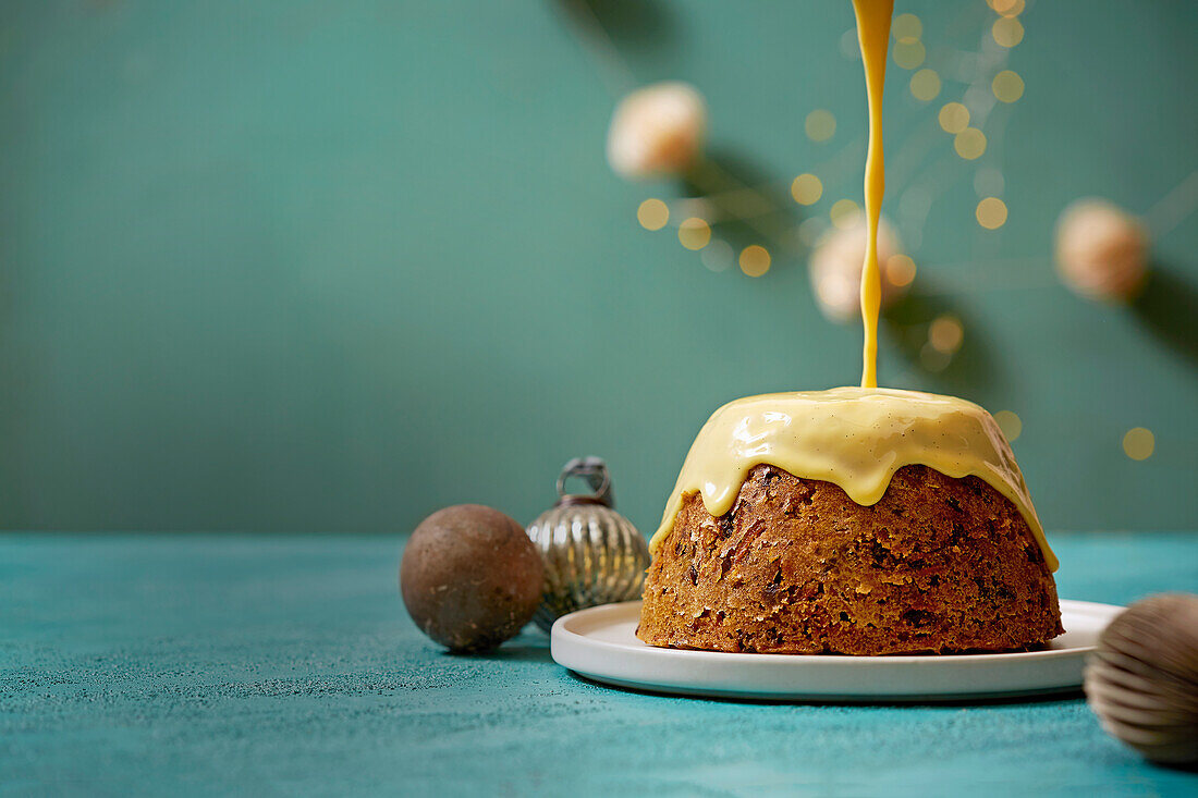 Steamed carrot pudding with vanilla sauce for Christmas
