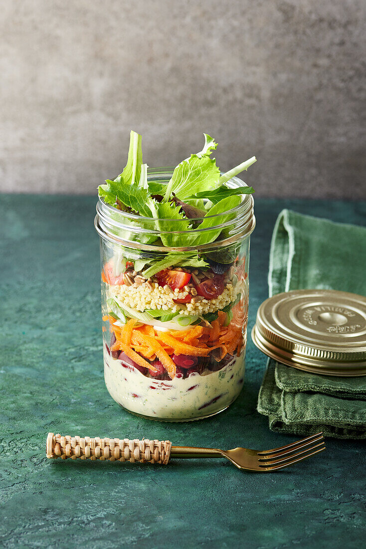 A vegetarian layered salad in a jar