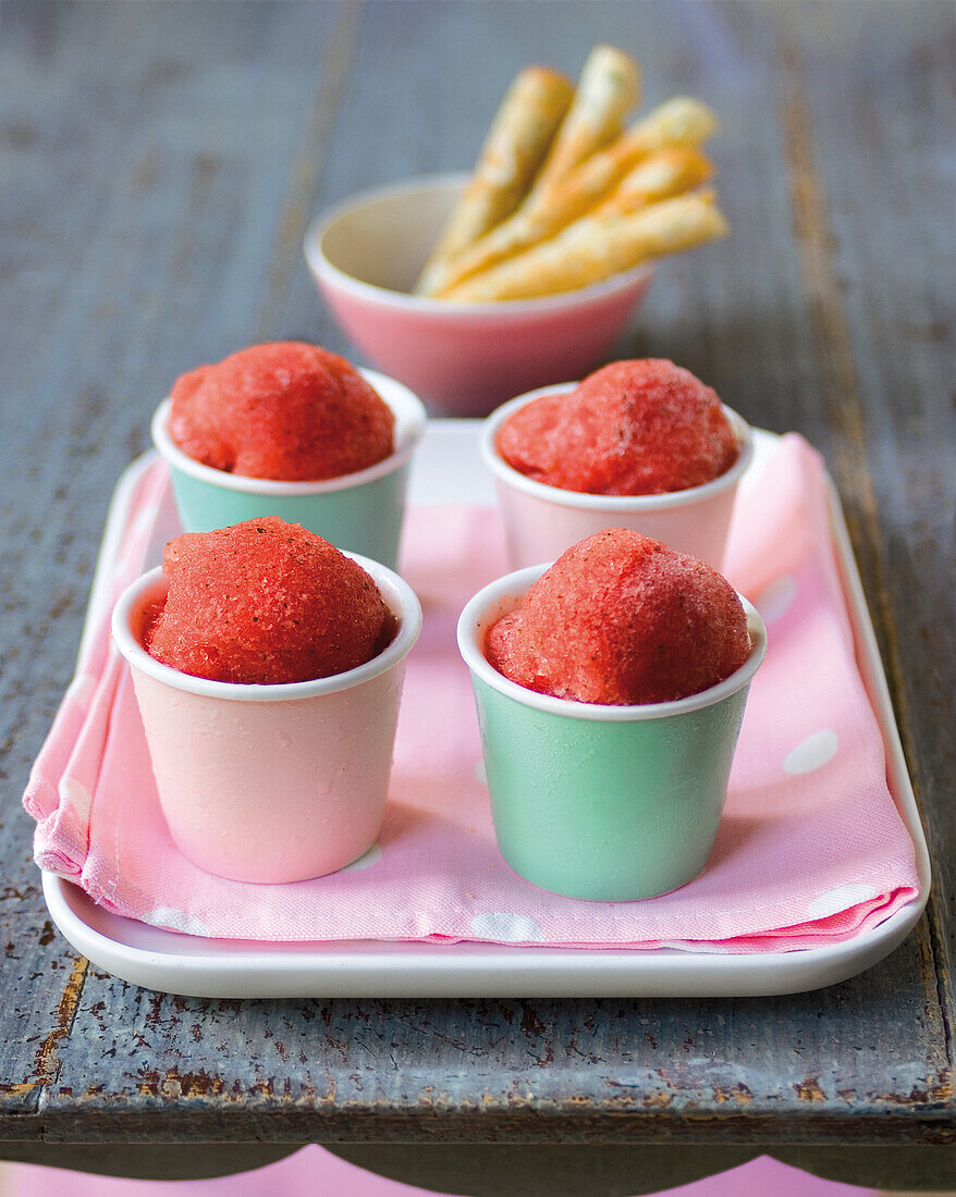 Watermelon sorbet in paper cups