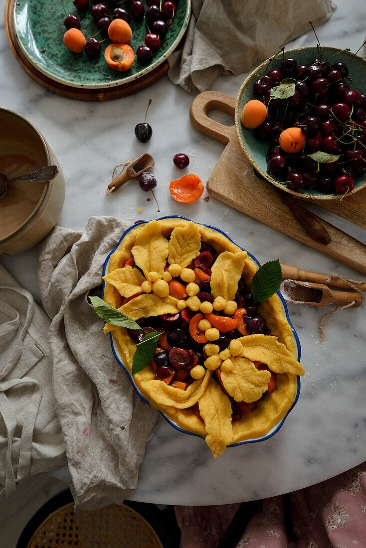 Tart with cherries and apricots, unbaked