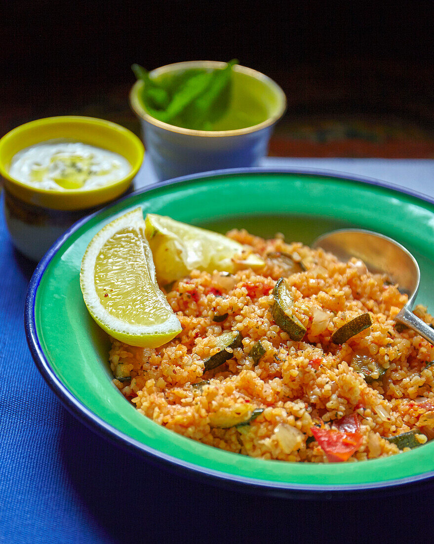 Bulgarian pilaf with zucchini, onions, and tomatoes