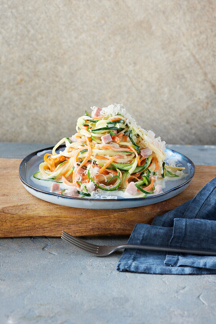 Vegetable noodles in a cream cheese sauce with ham