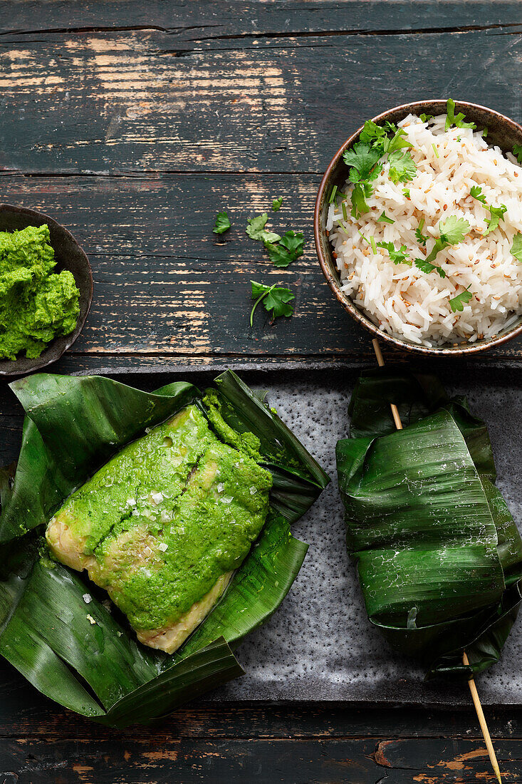 Catfish fillet wrapped in banana leaves served with rice