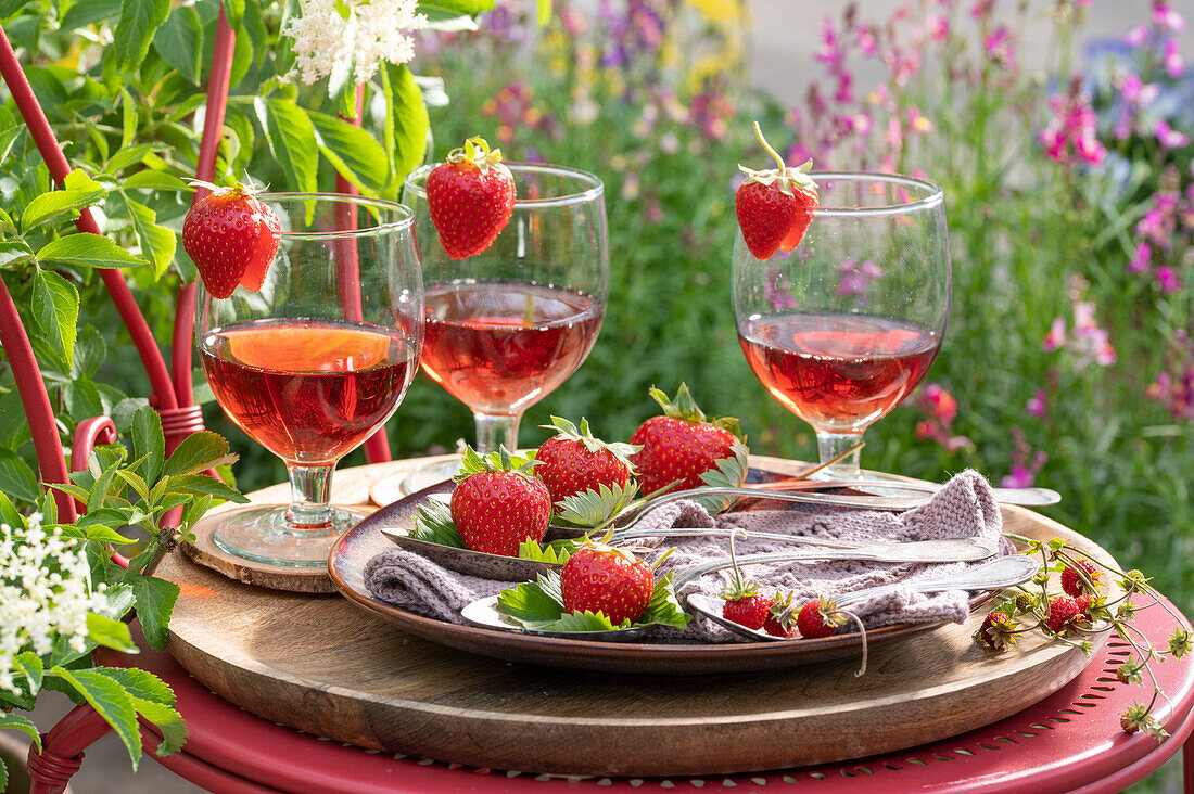 Drinks in glasses decorated with fresh strawberries