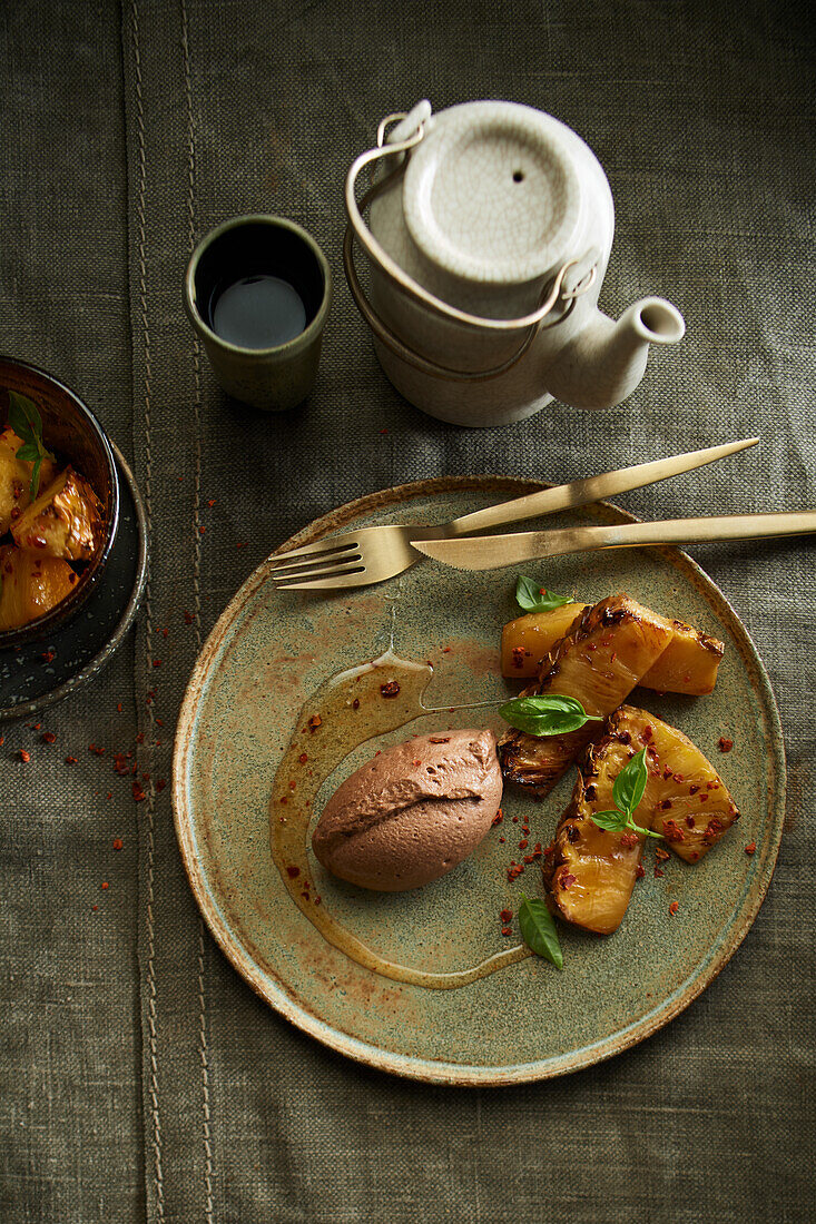 Chocolate mousse with smoked pineapple and tea