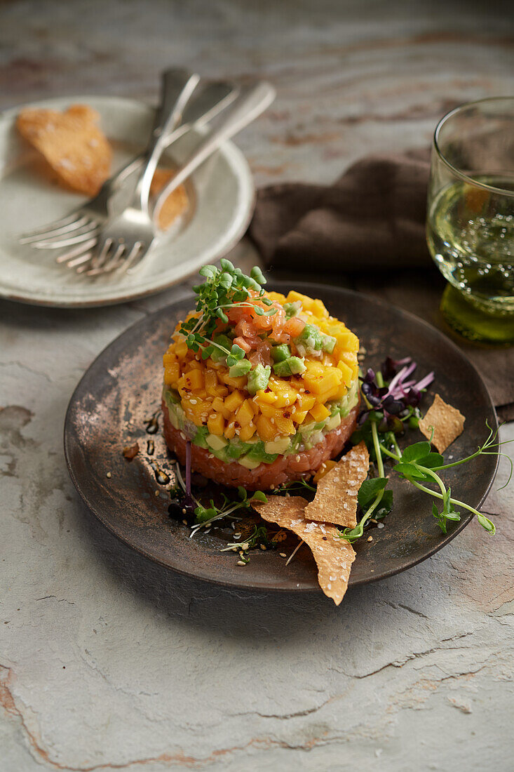 Marinated salmon tartare with mango and avocado