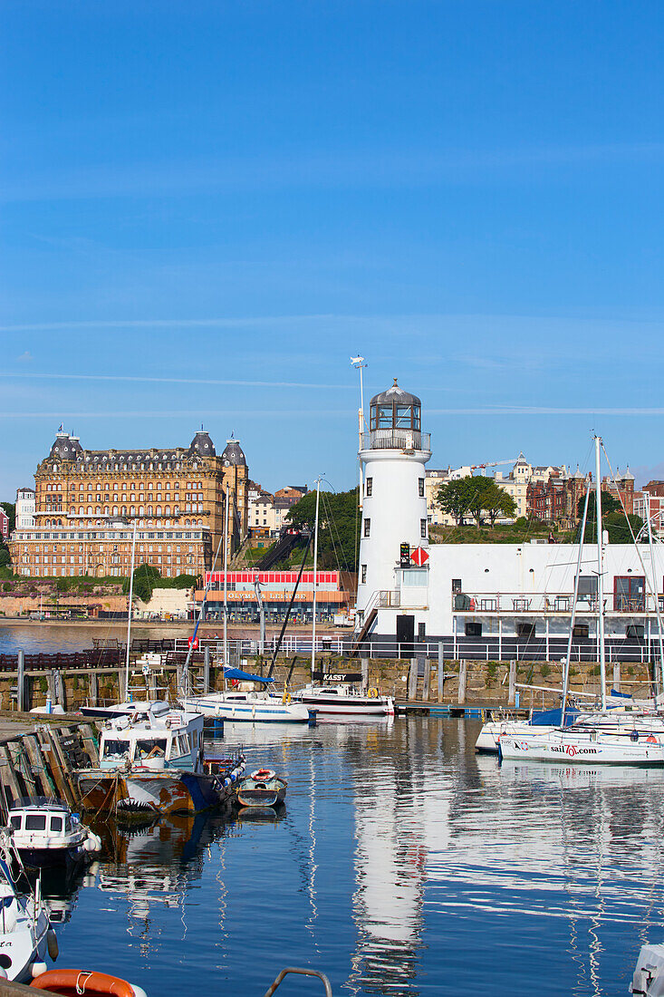 View of South Bay, looking towards the lighthouse and Grand Hotel, Scarborough, Yorkshire, England, United Kingdom, Europe