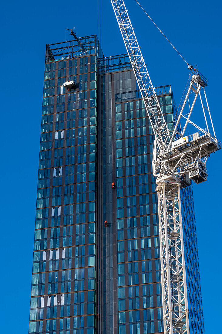 Cranes and workers on an apartment building site, Manchester, England, United Kingdom, Europe