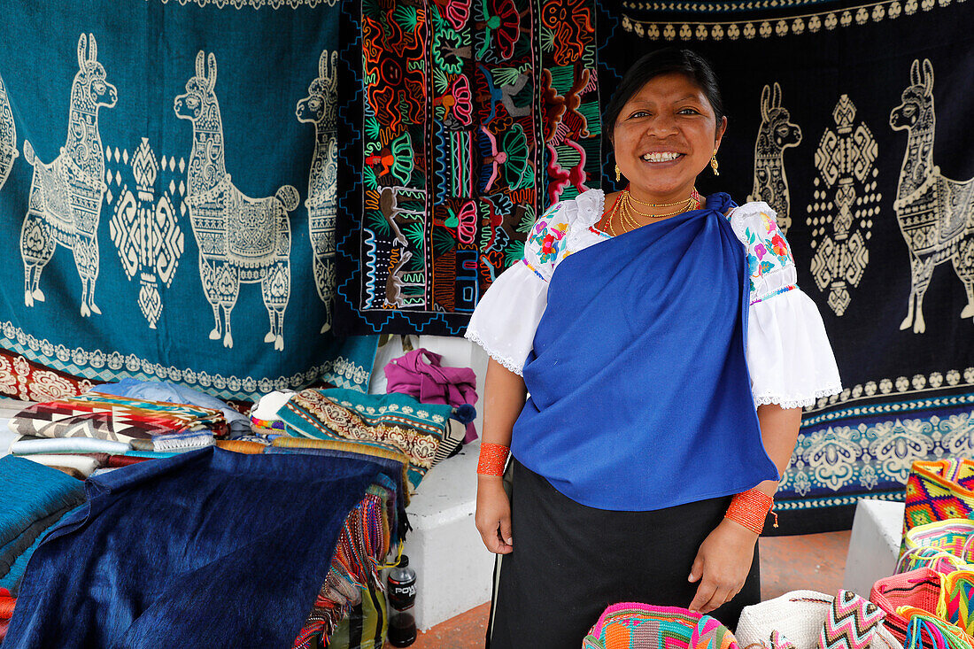 Stall holder at Otavalo market, Otavalo, Ecuador, South America