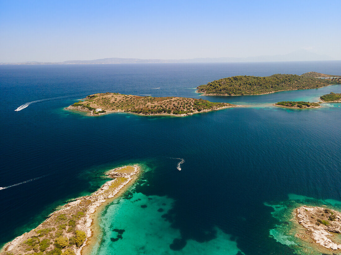 Drone shot above Sithonia, Chalkidiki peninsula, with small islands and clear waters, Crete, Greek Islands, Greece, Europe