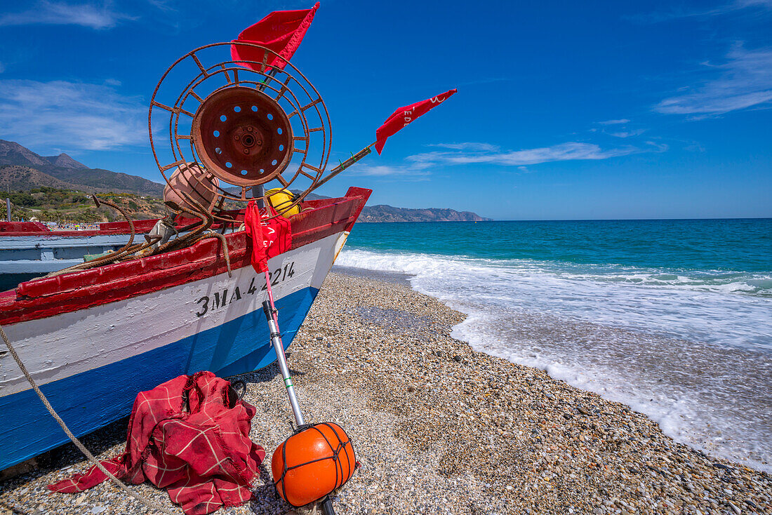 View of boat on Playa de Burriana beach in Nerja, Costa del Sol, Malaga Province, Andalusia, Spain, Mediterranean, Europe