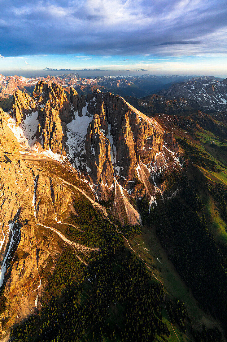 Aerial view of Sassopiatto group and Cinque Dita sharp mountains at sunset, Dolomites, South Tyrol, Italy, Europe