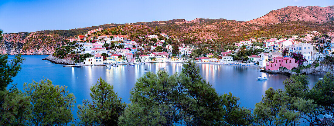 Multicolored houses in the fishing village of Assos at dusk, Kefalonia, Ionian Islands, Greek Islands, Greece, Europe